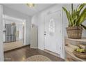 Bright foyer featuring hardwood floors, stylish decor, and a welcoming entrance at 2216 Umbrella Tree Dr, Edgewater, FL 32141