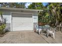 Attached garage offers ample parking space, plus an outdoor patio area for relaxing at 2249 Swoope Dr, New Smyrna Beach, FL 32168