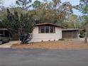 Street view of a comfortable single-story home with a covered parking area and tidy landscaping at 225 Peppertree Ct, Lake Mary, FL 32746