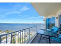 Enjoy water views from the balcony with table and chairs with sliders into the condo at 2801 S Ridgewood Ave # 1214, South Daytona, FL 32119