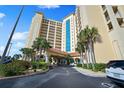 Exterior of building shows elegant architecture and landscaping at 2801 S Ridgewood Ave # 1214, South Daytona, FL 32119