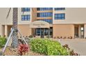 Lush landscaping surrounds the well-kept entryway of Oceans One condominium at 3051 S Atlantic Ave # 2206, Daytona Beach, FL 32118