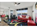 Bright living room with a water view, colorful accents, and stylish furnishings at 521 Marina Point Dr # 521, Daytona Beach, FL 32114