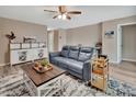 Cozy living area with a plush gray sofa and a stylish coffee table setup at 605 Anderson Dr, Deltona, FL 32725