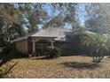 Well-kept one-story house featuring a manicured front lawn and traditional architectural design at 961 Oakwood Rd, Orange City, FL 32763
