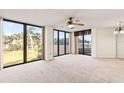 Bright living room with large windows providing natural light and beautiful views of the outdoors at 1 Oceans West Blvd # 1B2, Daytona Beach, FL 32118