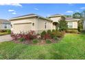 Inviting single-story home with attached garage and colorful, manicured landscaping at 1341 Hayton Ave, Deland, FL 32724