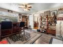 Open bar space with view into dining area, hardwood floors, and wood shelving at 1930 S Clara Ave, Deland, FL 32720