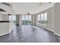 Bright living room with water views, wood-look floors, and lots of natural light at 231 Riverside Dr # 1801-1, Daytona Beach, FL 32117