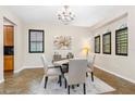 Inviting dining area featuring a decorative chandelier and lots of natural light at 3346 Pegaso Ave, New Smyrna Beach, FL 32168