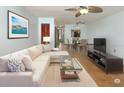 Inviting living room with a comfortable sectional sofa, modern decor, and a seamless flow to the dining area at 3960 Willow Trail Run # 45, Port Orange, FL 32127