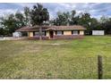 Inviting single-story home on a spacious lot, complemented by a well-kept lawn at 4605 Hard Rock Cv, Sanford, FL 32773