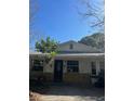 Charming single-story home with a stone accent and mature landscaping at 485 Dickson Ave, Osteen, FL 32764
