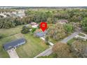Aerial view of property showcasing lush landscaping, surrounding trees, and privacy at 512 Power Rd, Sanford, FL 32771