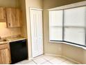 Kitchen nook featuring ample cabinet space, granite countertops, and a corner window at 662 Comstock Dr, Deltona, FL 32738