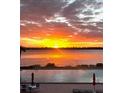 Stunning waterfront view from the pool at sunset, creating a serene and luxurious ambiance at 925 N Halifax Ave # 910, Daytona Beach, FL 32118