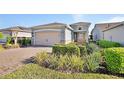 Attractive single-Gathering home boasting a brick driveway and meticulously maintained front yard at 1079 Lincolnshire Dr, Deland, FL 32724