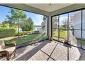 Relaxing screened-in patio with a view of the lake, perfect for outdoor enjoyment at 1079 Lincolnshire Dr, Deland, FL 32724