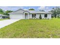 Charming one-story home featuring a lush lawn and inviting curb appeal at 1329 N Old Mill Dr, Deltona, FL 32725