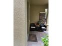 Inviting front porch with two cushioned chairs on a brick paver porch at 1812 Leather Fern Dr, Ocoee, FL 34761