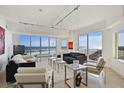 Bright living room features tile floors, modern furniture, and amazing ocean views at 1900 N Atlantic Ave # 504, Daytona Beach, FL 32118