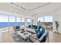 Bright living room with ocean views, contemporary furniture, and modern lighting at 1900 N Atlantic Ave # 504, Daytona Beach, FL 32118