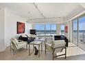 Open living room filled with bright light, floor to ceiling windows, and ocean view at 1900 N Atlantic Ave # 504, Daytona Beach, FL 32118