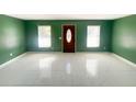 Bright living room featuring large windows and elegant tile floors at 2044 7Th Ave, Deland, FL 32724