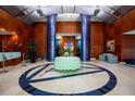 Grand lobby featuring elegant columns, decorative lighting, and seating area, offering a luxurious welcome at 241 Riverside Dr # 207, Daytona Beach, FL 32117