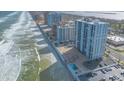 Aerial view of a beachfront property with condos, pools, and beautiful ocean views at 3003 S Atlantic Ave # 19B4, Daytona Beach, FL 32118