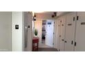 Hallway leading into unit with decorative decor and unit information displayed at 3003 S Atlantic Ave # 19B4, Daytona Beach, FL 32118