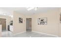Open-concept living space with modern lighting, fresh paint, and sleek marble floors at 4333 Arch St, Orlando, FL 32808