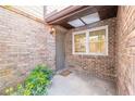 Charming brick entryway with a cozy welcome mat and ample natural light at 60 N Halifax Dr # 1050, Ormond Beach, FL 32176
