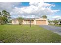Inviting single-Gathering home with an attached garage, front lawn and landscape and traditional design at 902 Cloverleaf Blvd, Deltona, FL 32725