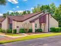 Attractive condo with a well-kept lawn, established landscaping, and inviting curb appeal at 101 Grand Plaza Dr # G60, Orange City, FL 32763