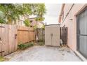 Enclosed backyard with a storage shed, plants, and fencing providing privacy at 108 Mitchell Pl # 108, Daytona Beach, FL 32118