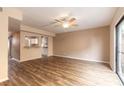Spacious living room featuring sliding glass doors, wood floors, and a ceiling fan at 108 Mitchell Pl # 108, Daytona Beach, FL 32118