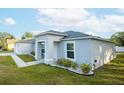 A view of the home's exterior, showcasing its architectural design and landscaping at 1162 Prescott Blvd, Deltona, FL 32738