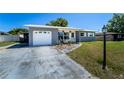 Charming single story home with a well-maintained front yard and a single car garage at 1199 Galgano Ave, Deltona, FL 32725