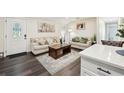 Bright and airy living room featuring stylish decor and hardwood floors at 1265 Aquarius Ave, Deland, FL 32724