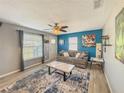 Inviting living room with stylish furnishings, including a plush sofa and marble coffee table at 1551 7Th Ave, Deland, FL 32724