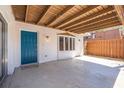 Spacious covered patio with a bright blue entry door and room for outdoor seating or entertaining at 171 Moonstone Ct, Port Orange, FL 32129