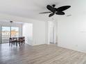 Dining room featuring light colored wood floors, a ceiling fan, and sliding glass doors to the outside at 1767 Valencia Ave, Ormond Beach, FL 32174