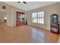 Bright, open-concept living area with neutral walls and wood-look flooring at 1963 Stacey Cir, Deltona, FL 32738