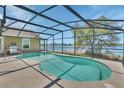 Stunning screened-in pool with a view of the water at 1963 Stacey Cir, Deltona, FL 32738