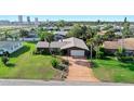 Charming single-story home with a long driveway, mature landscaping, and a well-manicured front lawn at 354 Georgetown Dr, Daytona Beach, FL 32118