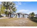 Single-story home with a well-maintained front yard, featuring a classic design at 723 Pelican Ct, Kissimmee, FL 34759