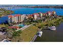 Aerial view of waterfront condominiums with a pool, boat docks and beautiful ocean views at 732 Marina Point Dr # 7320, Daytona Beach, FL 32114