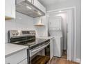 Updated kitchen featuring modern appliances and a convenient, in-unit washer and dryer at 852 Derbyshire Rd, Daytona Beach, FL 32117