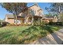 Beautiful two-story home with a lush green lawn and mature trees at 104 W Lake Victoria Cir, Deland, FL 32724